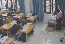 The teacher dangling shoeplay and dipping many times during class 13