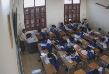 The teacher dangling shoeplay and dipping many times during class 25