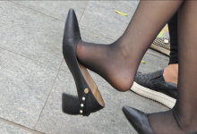 Black nylon feet dangling and white nylon sole dipping