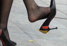 black nylon feet dangling and shoeplay 