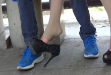 Girl in stirrup trousers dangling heels