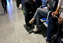 Girl dangling shoeplay when waiting for a train 19