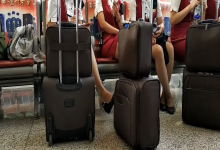 Lady great dangling shoeplay when waiting for the train in railway station lounge 24