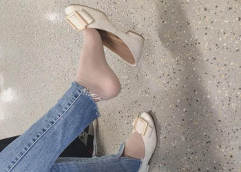 The lady in white heels dangling shoeplay when waiting for a call 14