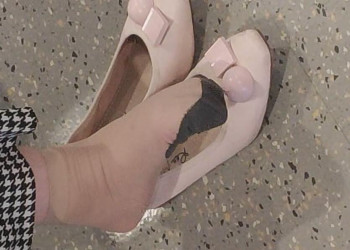 The beautiful woman in  special pattern stockings dangling shoeplay