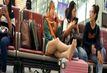 Lady remove heels relax her white nylon feet at railway station lounge 5