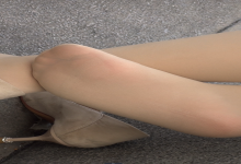 Lady in deerskin high heels relax her tired feet on the chair