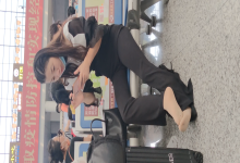 Lady remove shoe and relax her tired feet when waiting for a train 45