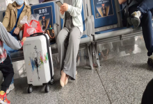 The lady remove shoes relax her tired feet when waitting for a train 13