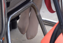 The girl remove her boot relax her sexy nylon feet