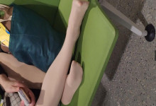 The lady relax her tired feet when line up in the waiting hall 110