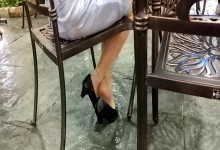 Girl shoeplay under the table when drinking tea