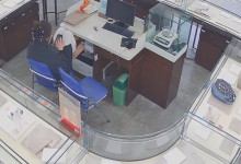 The jewelry store hostess remove heels and put her feet on the table