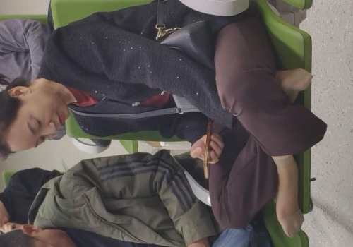 The lady remove heels relax her sexy nylon feet waiting for a call at the hospital 7