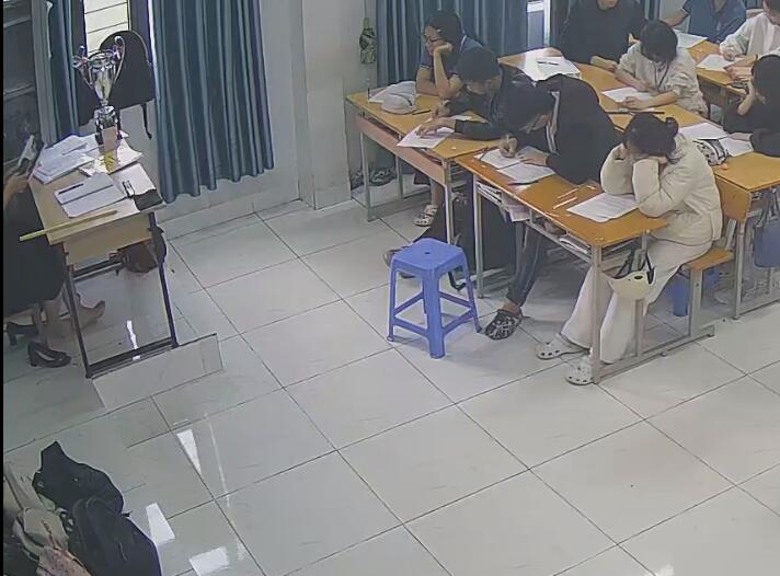 The teacher remove heels relax her tired feet under the table