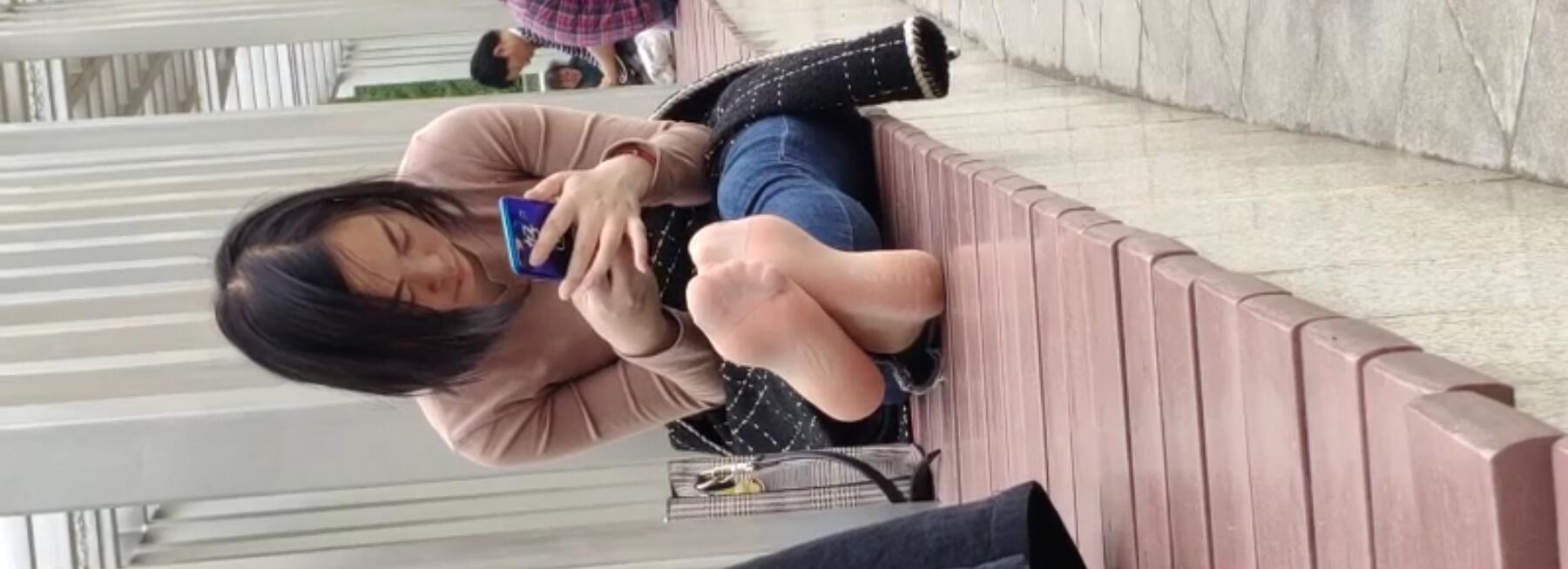 Lady remove heels relax her tired feet when line up in the waiting hall 19