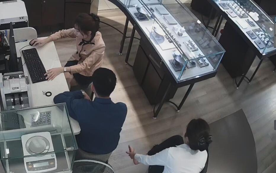 The pretty jewelry store hostess dangling shoeplay and foot massage by herself