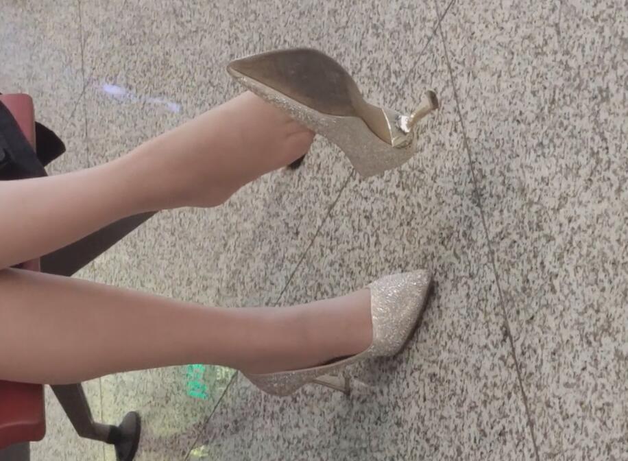 The lady in white heels dangling shoeplay when waiting for a call 11