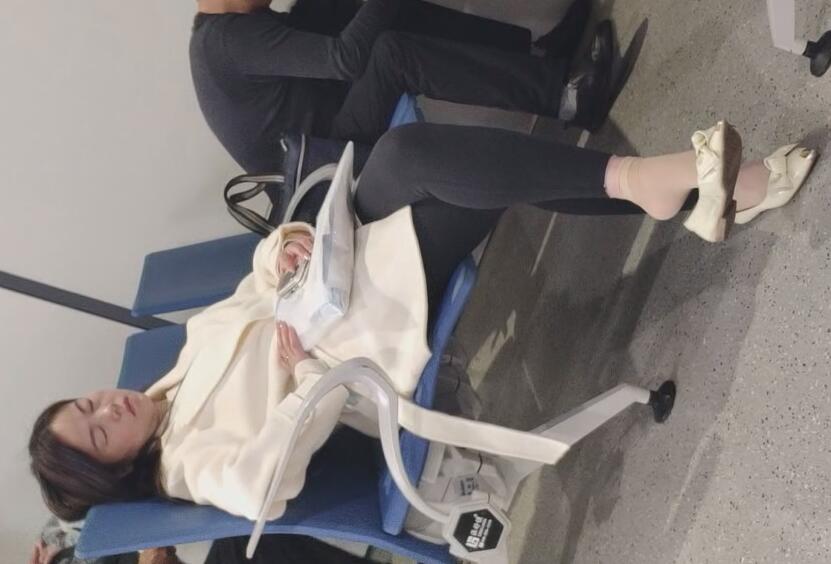 The beautiful woman fell asleep with dangling 