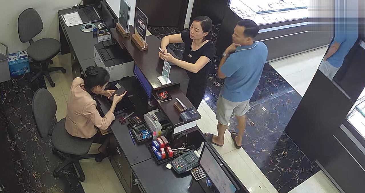 The jewelry store cashier candid shoeplay under the table 