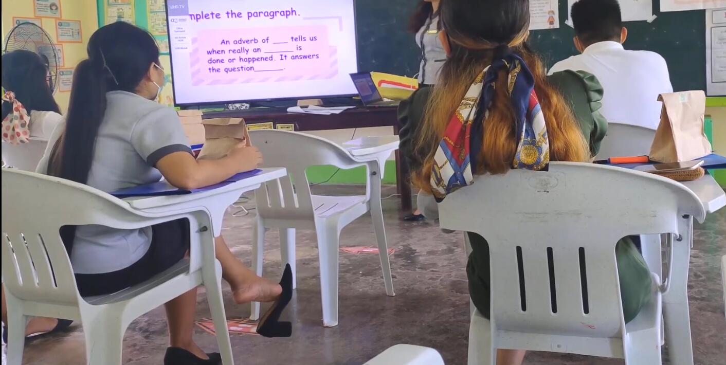 The student dangling shoeplay in class 12