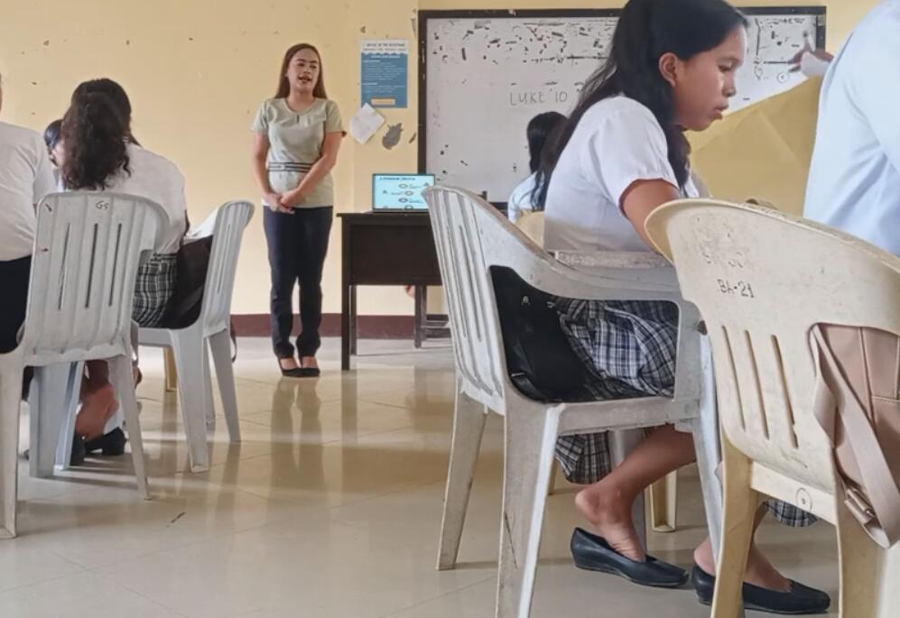 The student dangling shoeplay in class 12